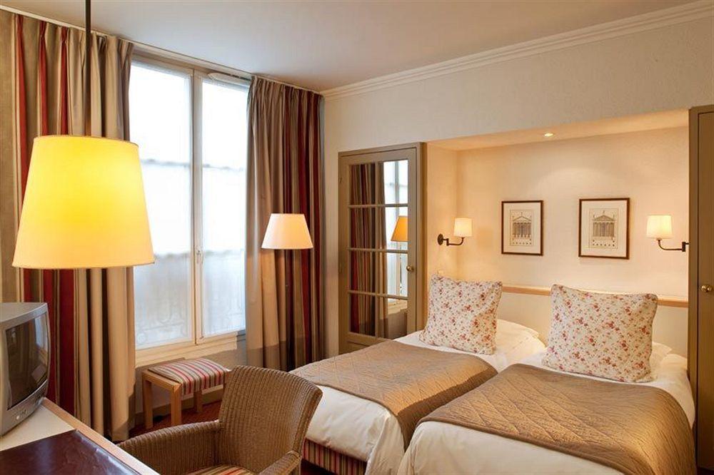 Hotel Henri IV Rive Gauche Париж Стая снимка